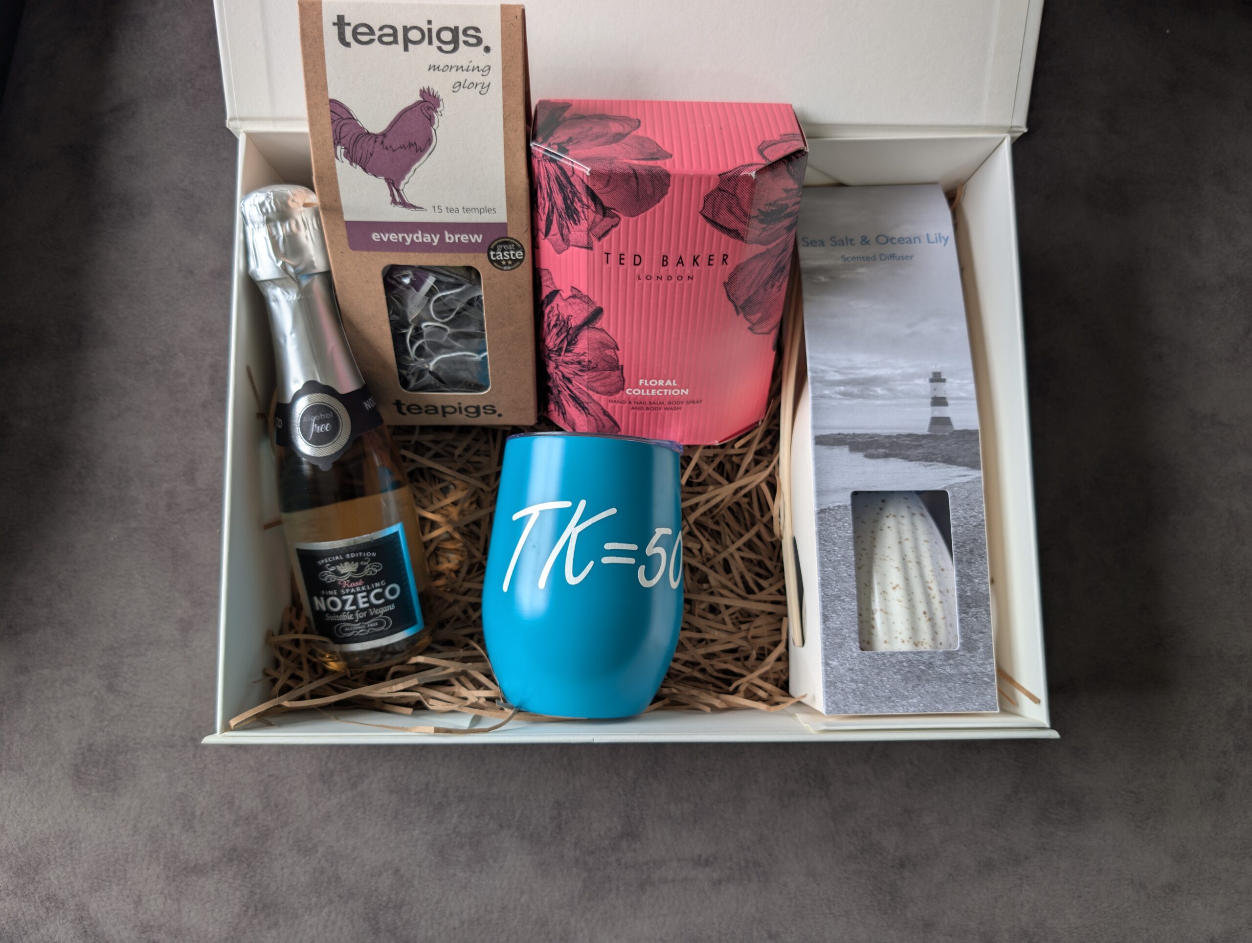 Milestone birthday gift box with Teapigs tea, Ted Baker floral collection, Nozeco, and diffuser